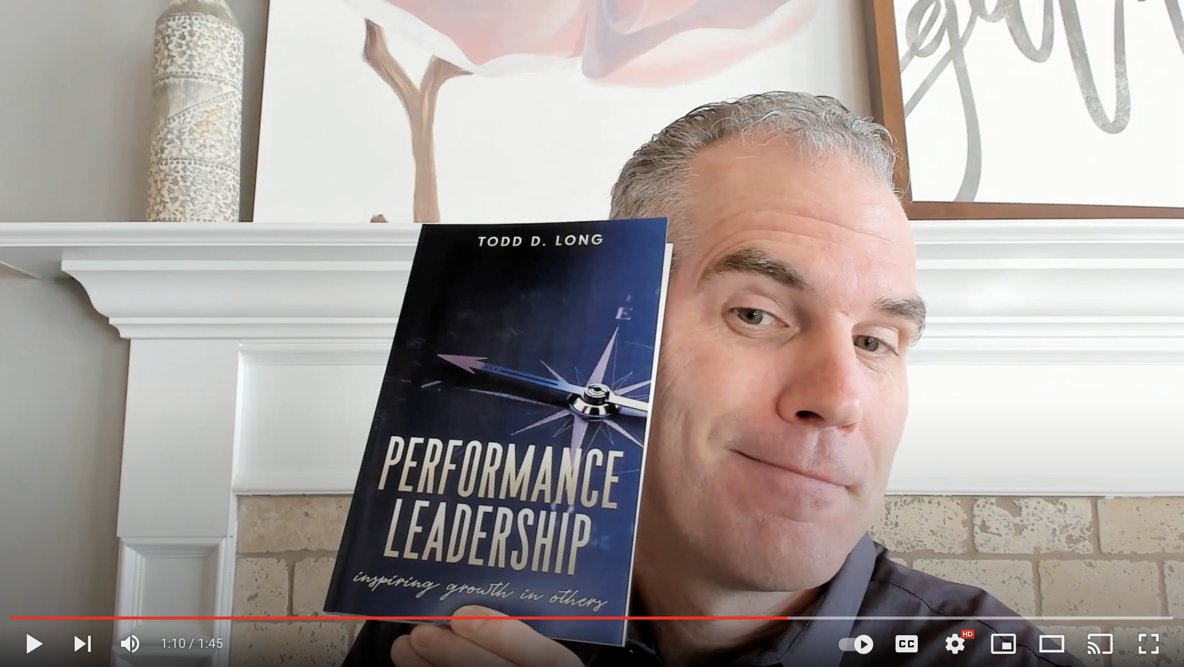 Todd holding the Performance Leadership book